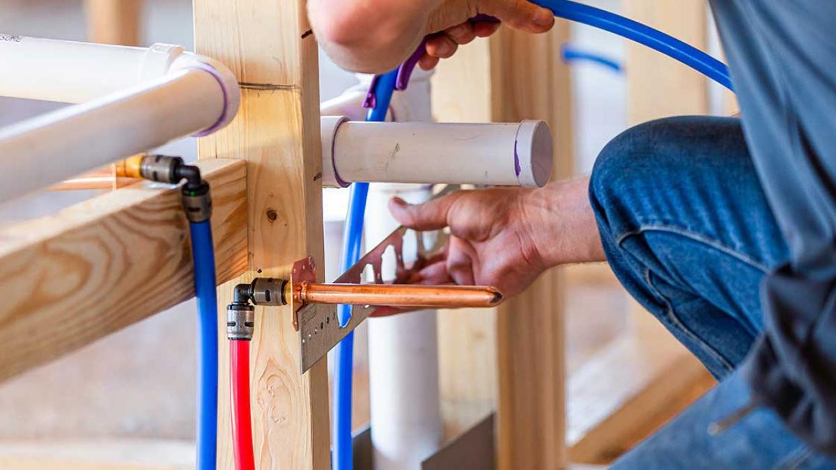 A person working on pipes.