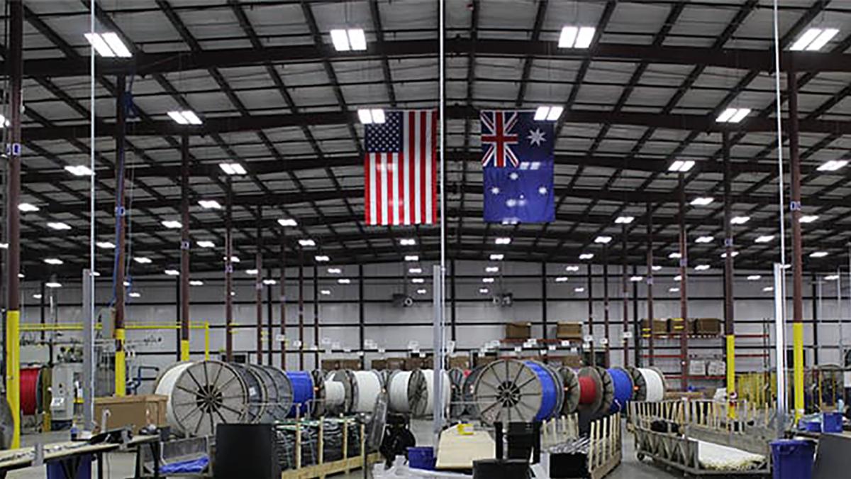 image of an American and Australian flag shown displayed in a manufacturing warehouse.