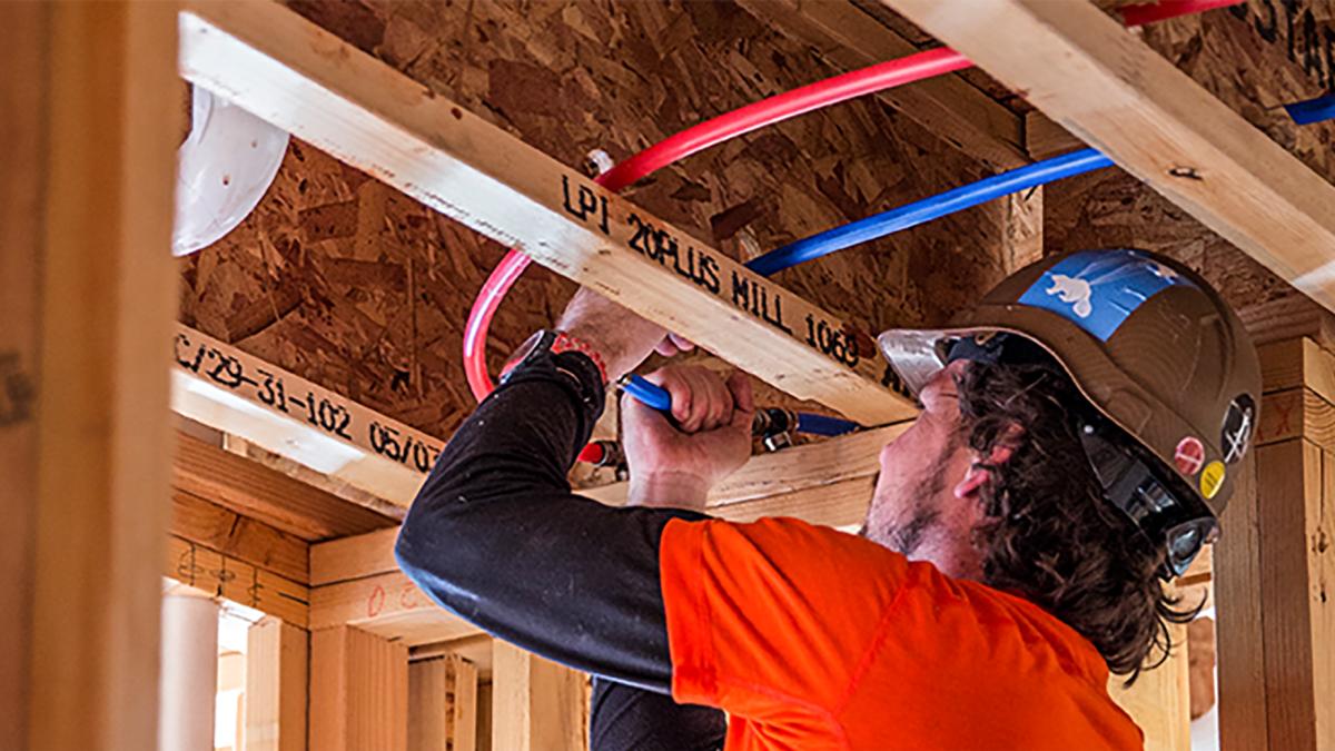 EvoPEX plumbing system installation in a new construction project, showcasing fast, flame-free connections for modern residential builds.