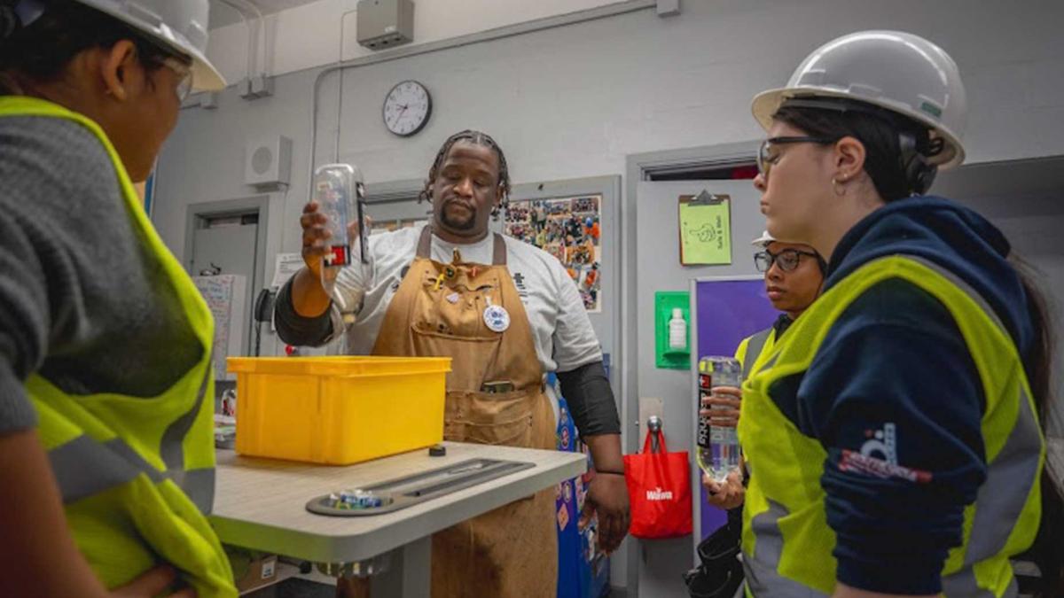 Philly CTE teacher Evin Jarrett teaches students in his plumbing program 
