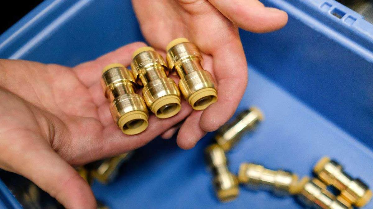 Inside look at SharkBite’s manufacturing facility, highlighting advanced plumbing technology and quality control in push-to-connect fittings production.