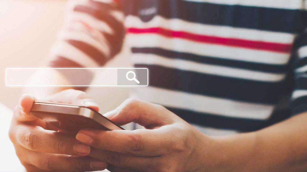 Image of a person on their mobile phone.