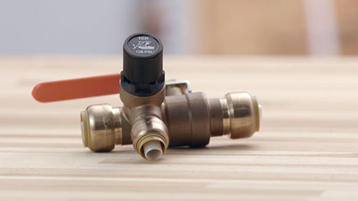close up of a thermal expansion relief valve laying on a table.