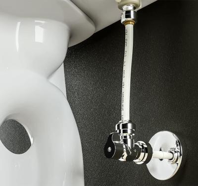 SharkBite brass push-to-connect toilet connection kit shown installed at back of toilet tank, providing leak-free water supply connection without tools or pipe threading for quick DIY installation