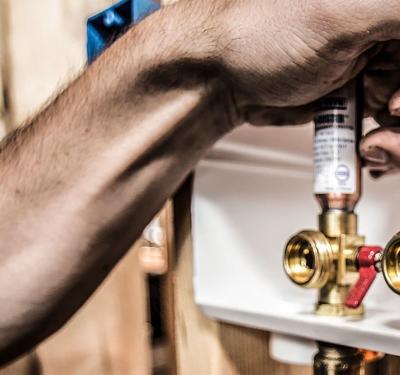SharkBite brass push-to-connect outlet box for washing machine and ice maker installations, featuring secure mounting system with no additional framing required for simple behind-wall plumbing connections
