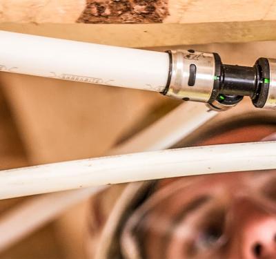 EvoPEX push-to-connect system being installed during home construction