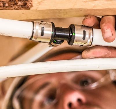 EvoPEX push-to-connect system being installed during home construction