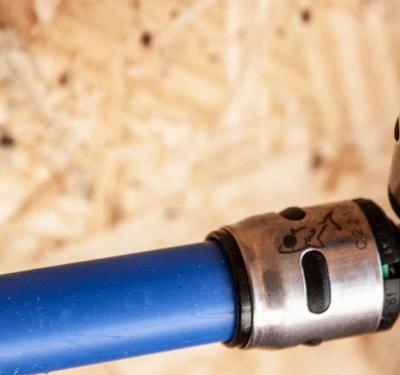 SharkBite push-to-connect fitting with flexible PEX-B tubing featuring pre-printed depth markings for secure, leak-free potable water connections