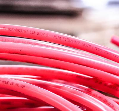 Coiled SharkBite PEX-A potable water tubing with superior flexibility and durability for residential and commercial plumbing applications