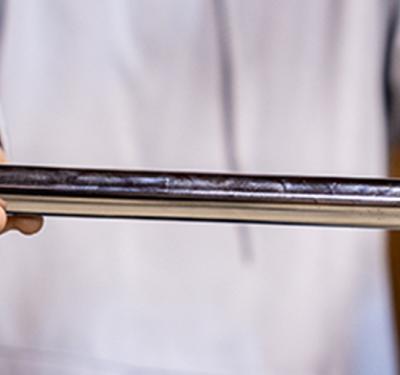 A plumber holding a frost-free sillcock with integrated push-to-connect inlet