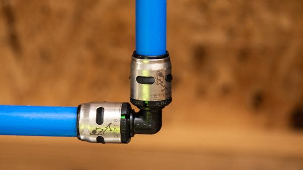 A SharkBite EvoPEX Push-to-Connect Fitting installed