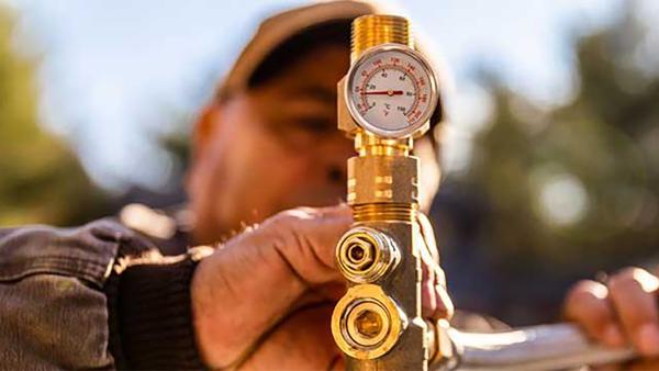 Close up of a SharkBite thermostatic mixing valve 