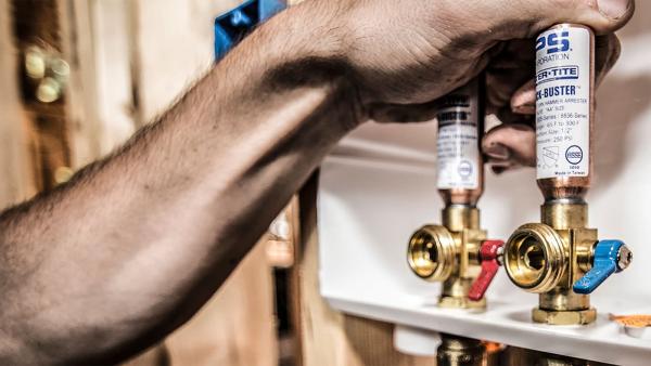 SharkBite brass push-to-connect outlet box for washing machine and ice maker installations, featuring secure mounting system with no additional framing required for simple behind-wall plumbing connections