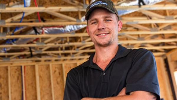 Young professional exploring a career in plumbing, representing opportunities in the skilled trades and the future of the plumbing workforce.
