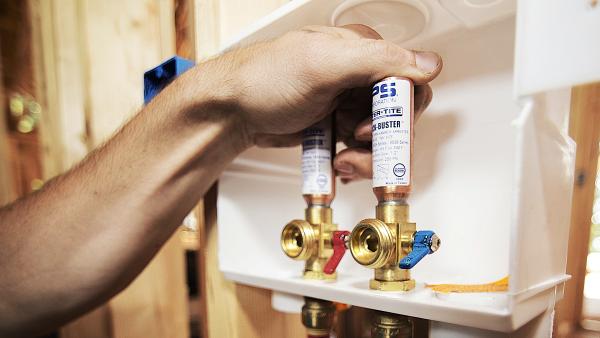 SharkBite brass push-to-connect outlet box for washing machine and ice maker installations, featuring secure mounting system with no additional framing required for simple behind-wall plumbing connections