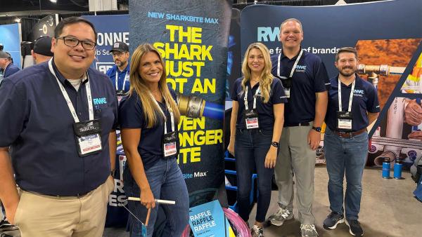 RWC employees pose in front of SharkBite booth at SkillsUSA 