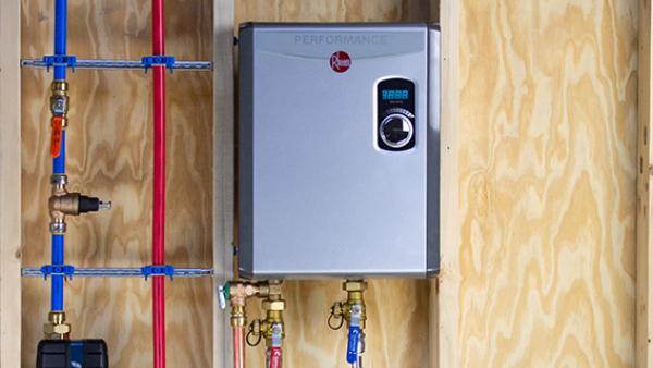 Tankless water heater installation using SharkBite fittings for compact and energy-efficient plumbing solutions