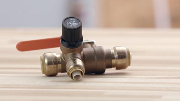 close up of a thermal expansion relief valve laying on a table.