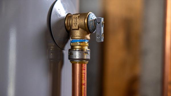 An installed SharkBite temperature and pressure relief valve