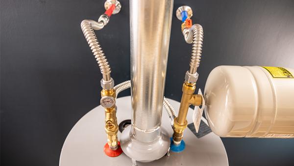 A water heater installed with SharkBite connectors.