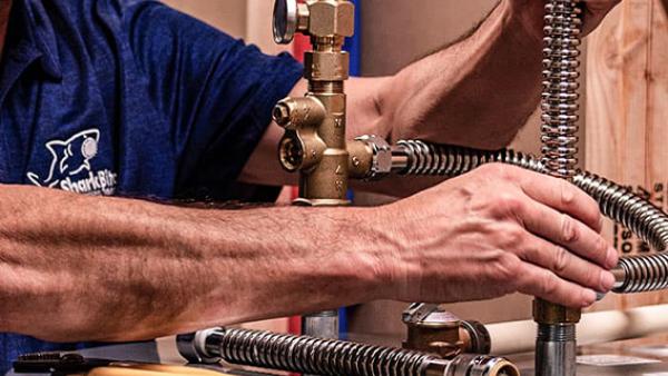 Water heater installation using SharkBite push-to-connect fittings for quick and reliable plumbing connections