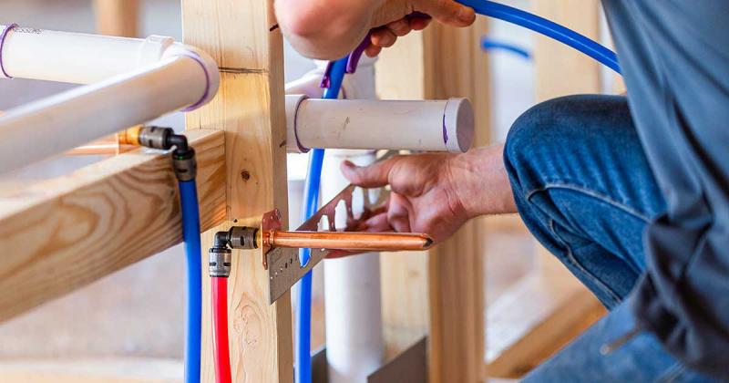 A person working on pipes.