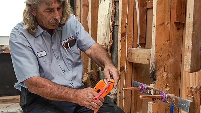 SharkBite Universal plumbing solutions featured in a residential renovation project, demonstrating versatility and ease of installation in retrofit applications.