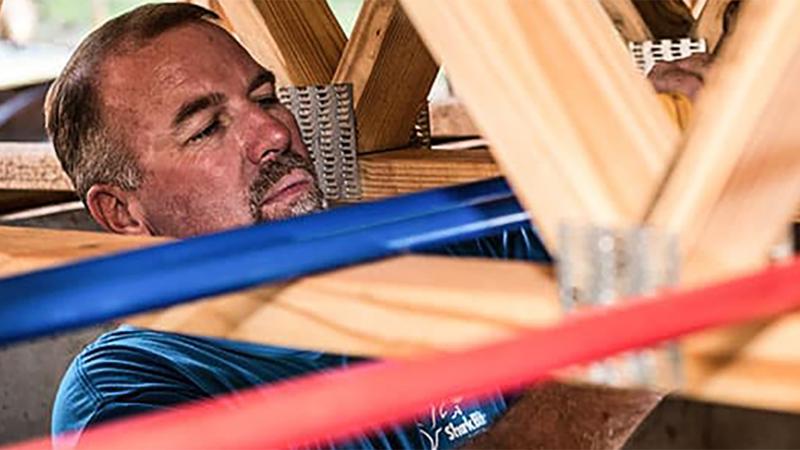 SharkBite plumbing systems installed in a single-family new construction home, highlighting fast and reliable water distribution solutions for residential builds.