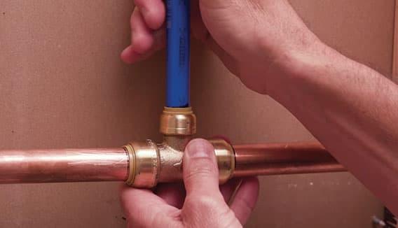 SharkBite push-to-connect copper tee fitting connecting copper pipes