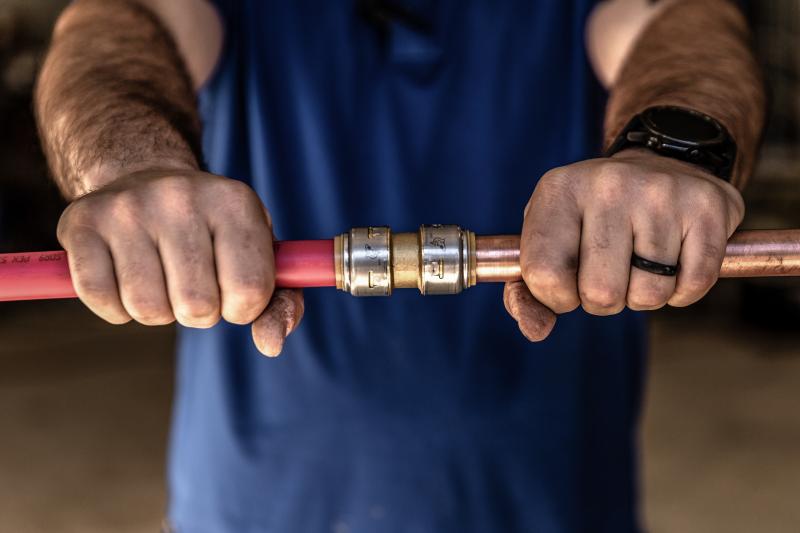 Installing SharkBite Max fitting on two pipes
